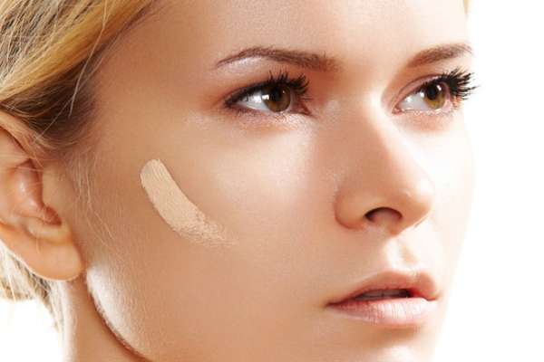 Cream foundation on customer skin