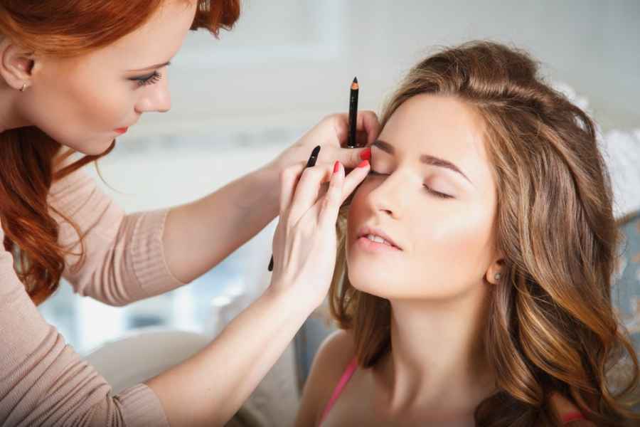 Makeup Consultant applying makeup to customer